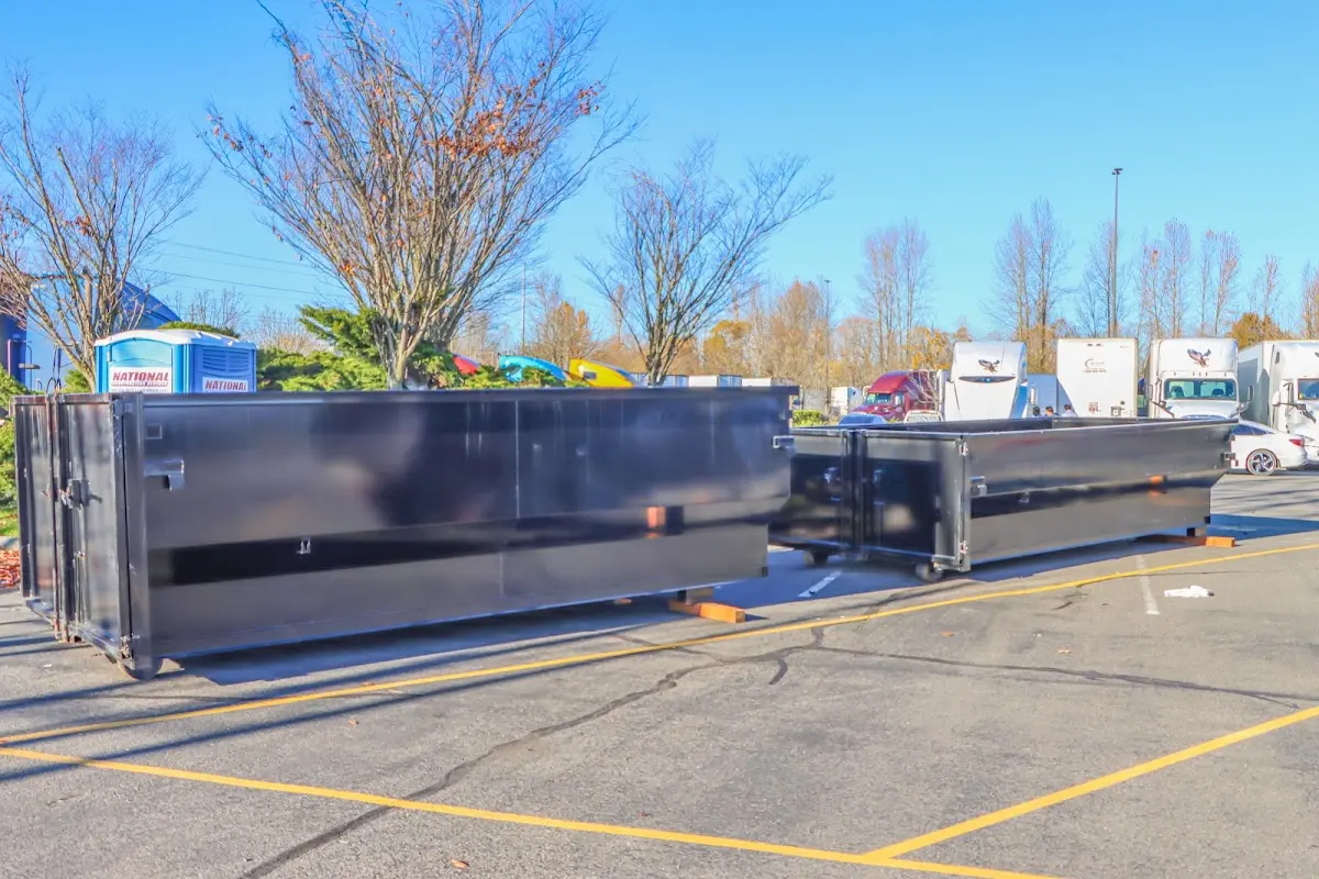 Professional dumpster rental service with roll-off container on residential driveway in Oak Brook